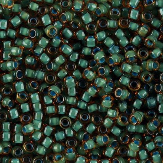 Picture of Topaz Colorlined Seafoam Seed Bead #399F / Size 8<br />Approximately 25 Grams